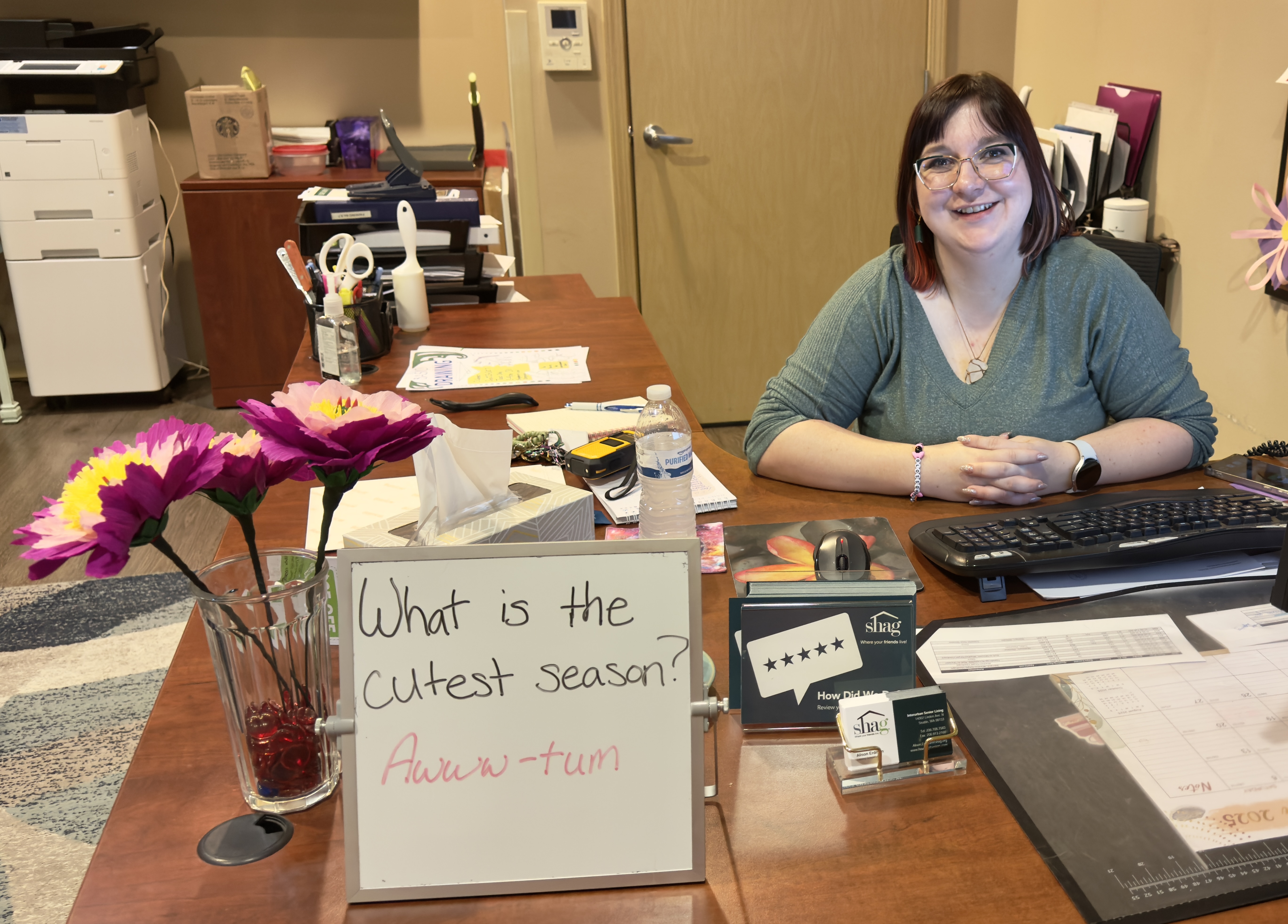 Alison smiling at her desk